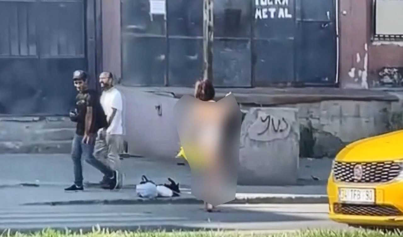 Yol kenarında soyundu! Trafiği araba kullanmadan birbirine kattı!
